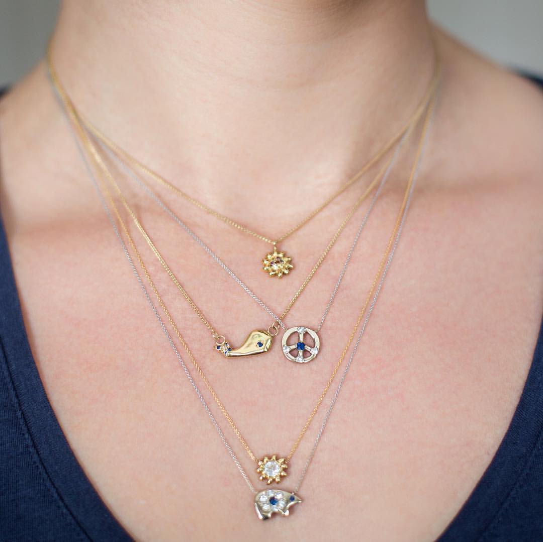 gold and platinum custom charm necklaces with gemstones and diamonds