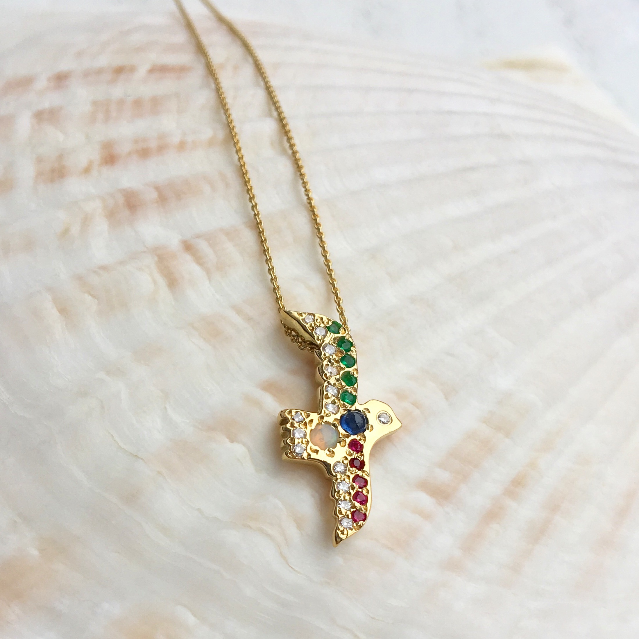 custom handmade flying bird gold necklace with opal and gemstones