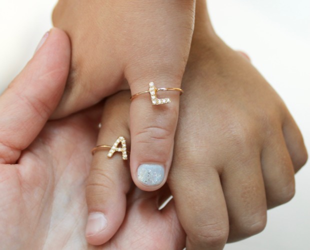 Mother and Daughter holding hands wearing the Letter Rings