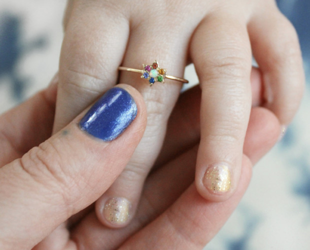 infant hand wearing the elisa solomon star ring