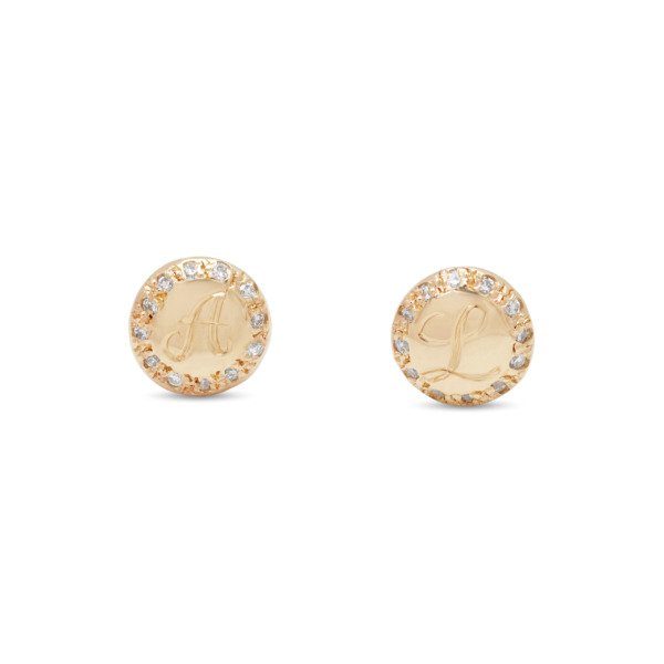 Letter engraved into the center of the gold circle stud earrings with diamonds around it