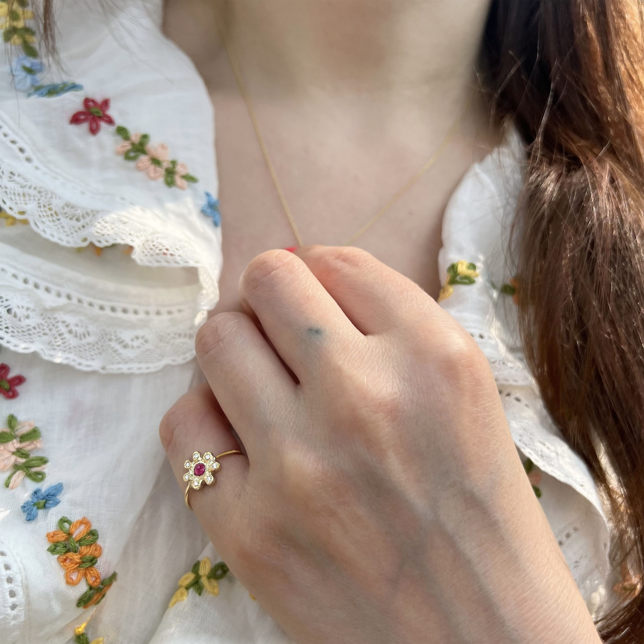 wearing the birthstone flower ring